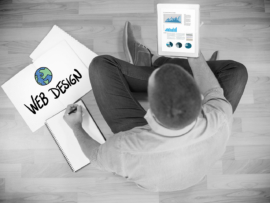 Case Studies 31 Business graphs against young creative businessman looking at tablet
